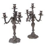 A pair of silvered metal four-branch candelabra Repoussé and chasing decorations 20th century h.