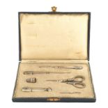 A sewing set with silver handles Comprising six pieces and a case early 20th century