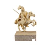 An antique German ivory sculpture modelled as Saint George on his horse with lance and shield, on