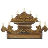 An Italian nine-branch candelabra Polychromatic-lacquered wood with floral ornamentations.
