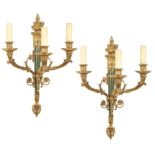 A pair of French ormolu three-branch wall-lights Finely chased and decorated with Impero style