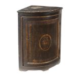 An Italian ebonized wood corner shelf With one door and a flower vase decoration.  Conditions: The