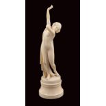 A French ivory sculpture Modelled as a femmine dancer on circular base 19th century h. 20 cm.