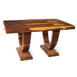 A French palisander Deco' table Rectangular top on two semicircular supports, with two extensions,