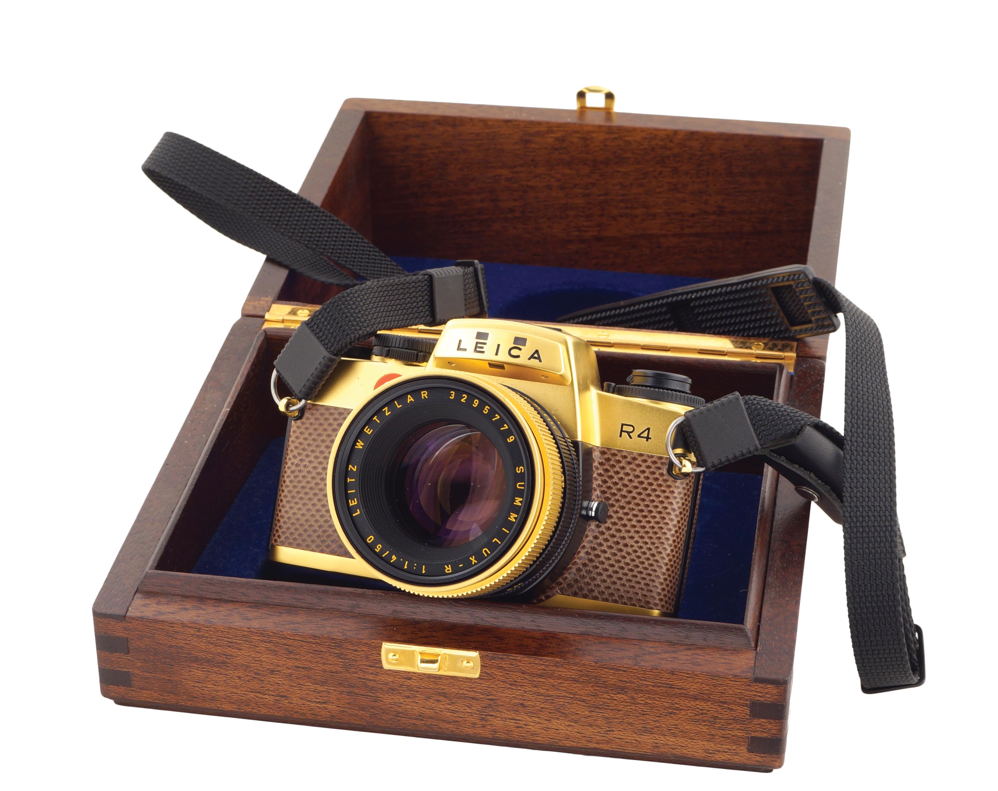 A 24K gold edition Leica R4 camera comprising W/Summilux-R 50mm/f1.4 lens kit and with wooden