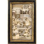 An engraved Persian ivory plaque Representing a scene of the everyday life, framed 19th century