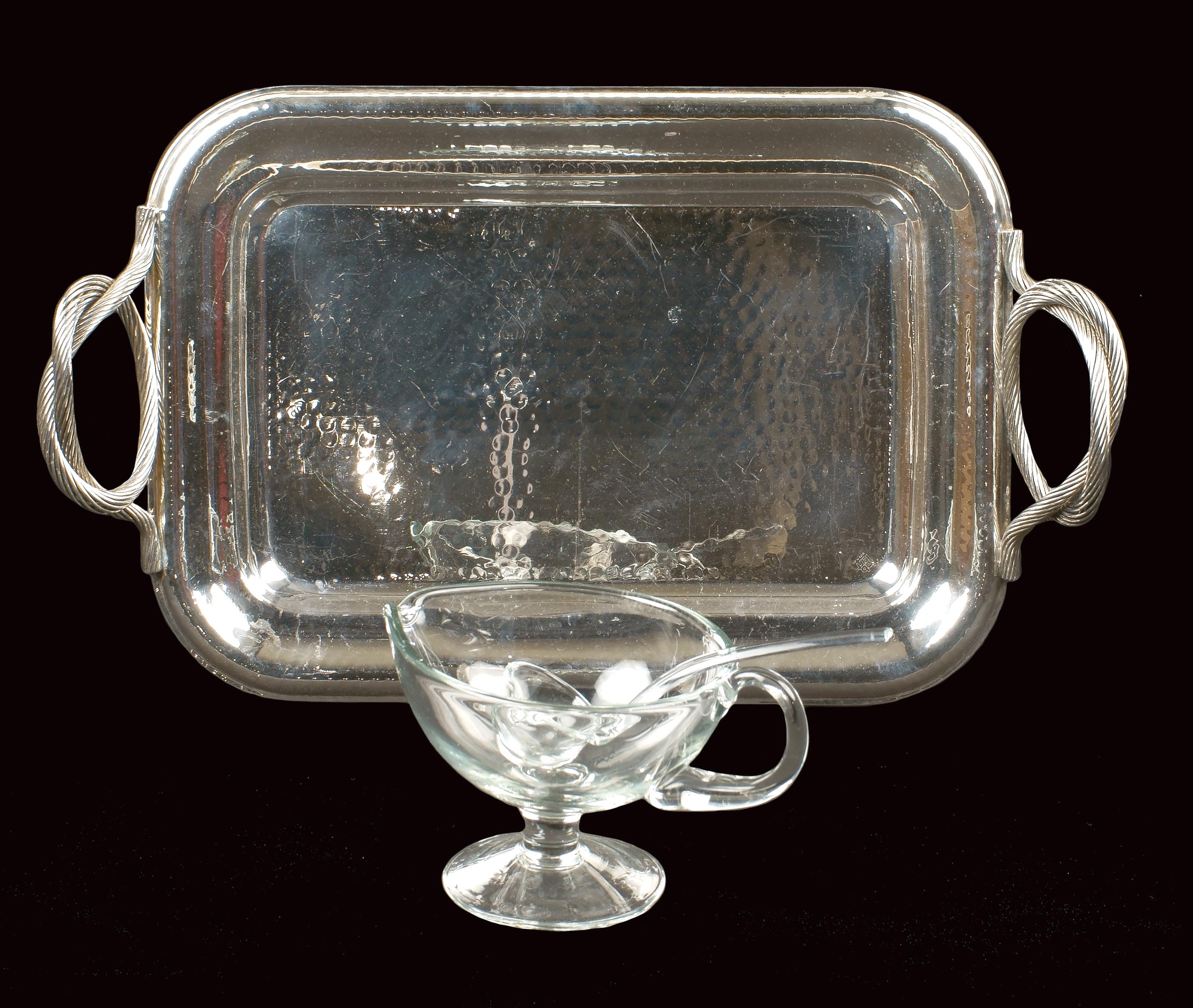 A mixed lot Comprising a rectangular silvered metal tray and a glass sauceboat 20th century