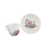 A Meissen porcelain cup with plate Painted with a genre scene in the style of David Terniers, mark