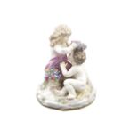 A Meissen porcelain group Partially gilt and modelled as two children with flowers, mark under