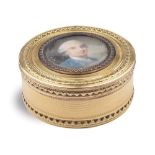 A French 18K gold tobacco box circular shaped, foliage decoration and in the center a miniature of a
