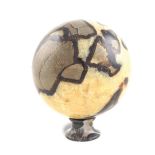 A marble sphere On Portoro marble base 20th century 18x16 cm.