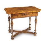 An Emilian walnut and olive wood table boxwood decorations and bobbin turned legs 18th century