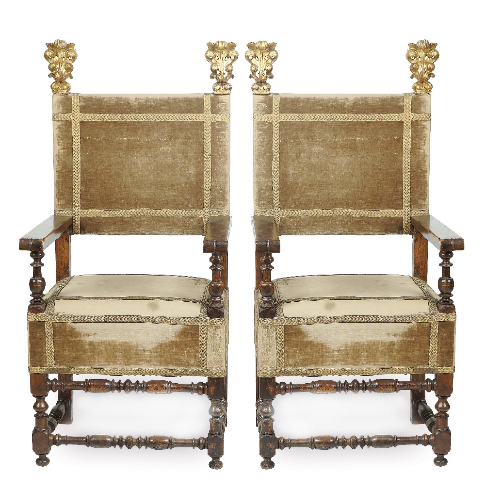 A pair of Italian walnut armchairs seating and seat back covered in fabric, friezes made of 19th