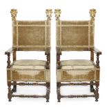 A pair of Italian walnut armchairs seating and seat back covered in fabric, friezes made of 19th