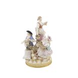 A Meissen porcelain group Polychromatic decorated and partially gilt, modelled as three disguised