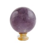 An amethyst sphere On a giallo di Siena marble base 20th century 16x13 cm.