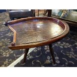 An early 20th century oak Thonet horseshoe shape occasional table, resting on three supports.