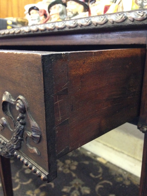 A mahogany side table with centre drawer with ram's head handle, resting on carved sabre supports. - Image 3 of 8