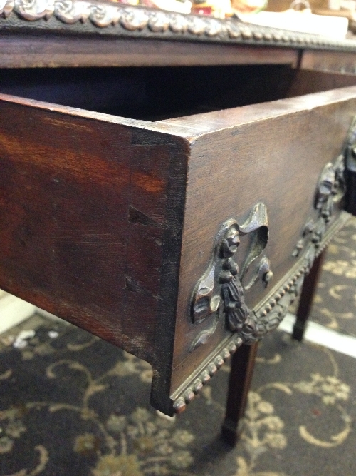 A mahogany side table with centre drawer with ram's head handle, resting on carved sabre supports. - Image 4 of 8