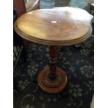 A mahogany circular occasional table.
