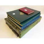 Four various stamp albums and contents together with a file containing a large quantity of stamps.