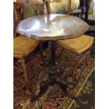 A 19th century walnut top occasional table on turned mahogany tripod base.