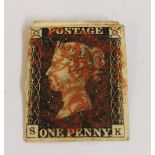 An 1840 Penny Black four margin stamp.