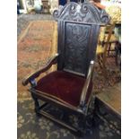 A 17th century Yorkshire Wainscot chair with carved and acanthus decorated back, resting on short