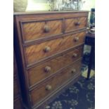 A light mahogany chest of two short and three long drawers.