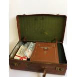 A suitcase containing a large quantity of stamps.