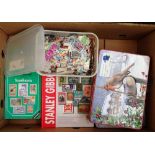 A box containing a large quantity of loose stamps and stamp related material.