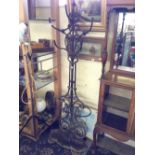 A 19th century Coalbrookdale cast iron hall stand with pierced naturalistic frame,