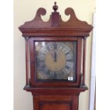 An early 18th century 30 hour oak longcase clock with silver and gold metal dial,