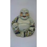 A Chinese porcelain figure of a Seated Smiling Buddha.