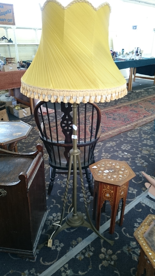 A brass Secessionist standard lamp.