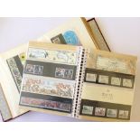 Two stock albums containing a large quantity of mint unused Royal Mail presentation packs ( in