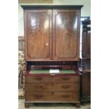 A late Georgian flame mahogany linen press secretaire with fitted cupboard,