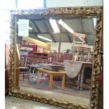 A large 19th century gesso framed gilt wall mirror (66 x 65 inches approx.).