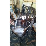 A 19th century oak and elm framed wheel back Windsor chair.