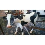 A full size fibreglass model of a black and white Calf.