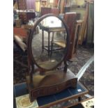An inlaid mahogany dressing table mirror with three drawers under.