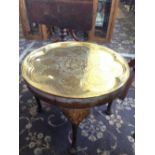 A brass tray top circular occasional table.