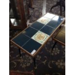 A mid 20th century Poole Pottery tile top coffee table,