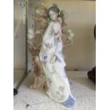 A Lladro glazed china figure modelled as an Oriental Female Figure (restored).