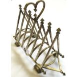 A silver plated six division angular Pugin style toast rack resting on four shaped feet.