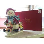 A Waterford ' Holiday Heirlooms ' china musical cookie jar modelled as Snowy Village Holiday on Ice