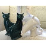 A small pair of Poole Pottery blue glazed china Cats together with two white glazed Poole Pottery