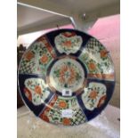 A 19th century Imari pattern dish, decorated with flowers and foliage.