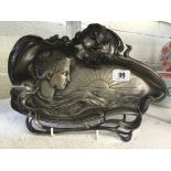 A WMF Art Nouveau pewter card tray decorated with a Female Figure with long sweeping hair looking