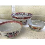 A 18th century hand painted china footed bowl decorated with flowers together with another and a